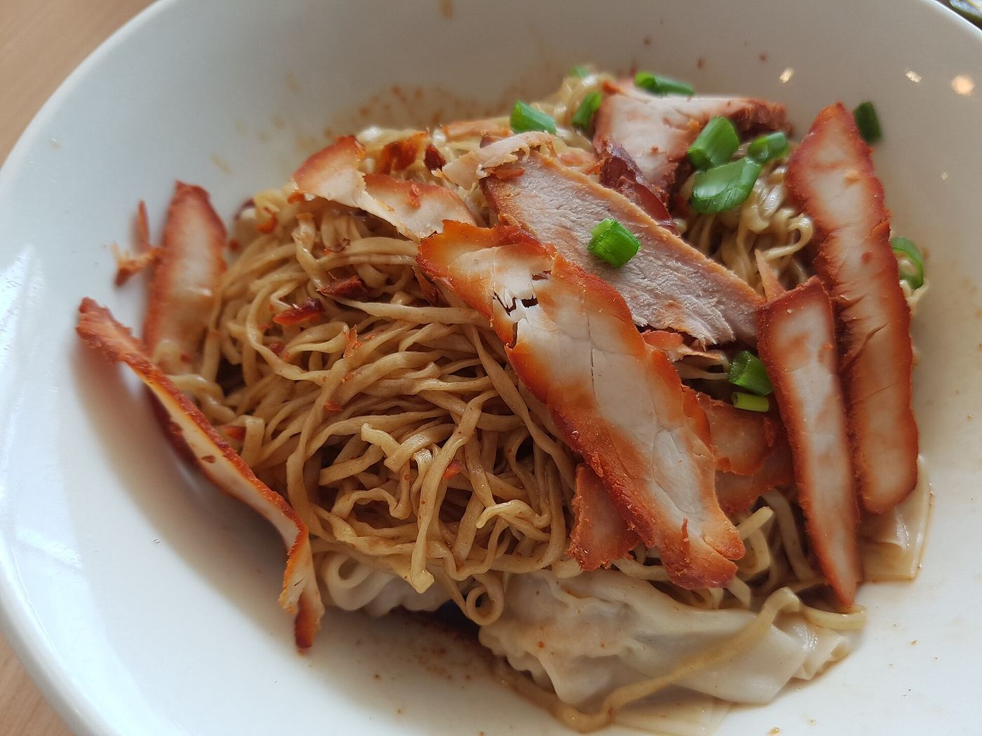 A plate of char siew noodles.